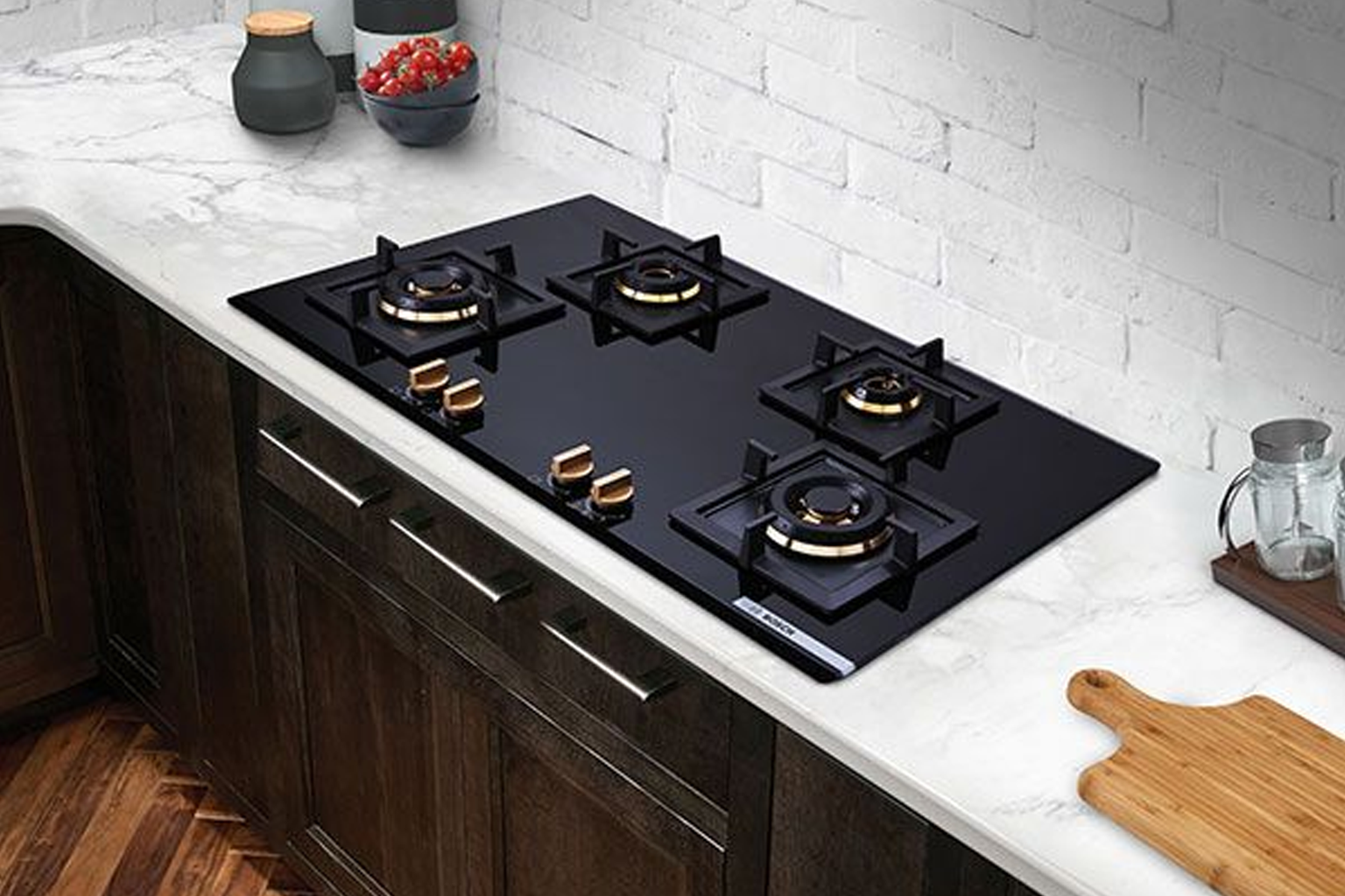Kitchen chimney installation above a cooktop